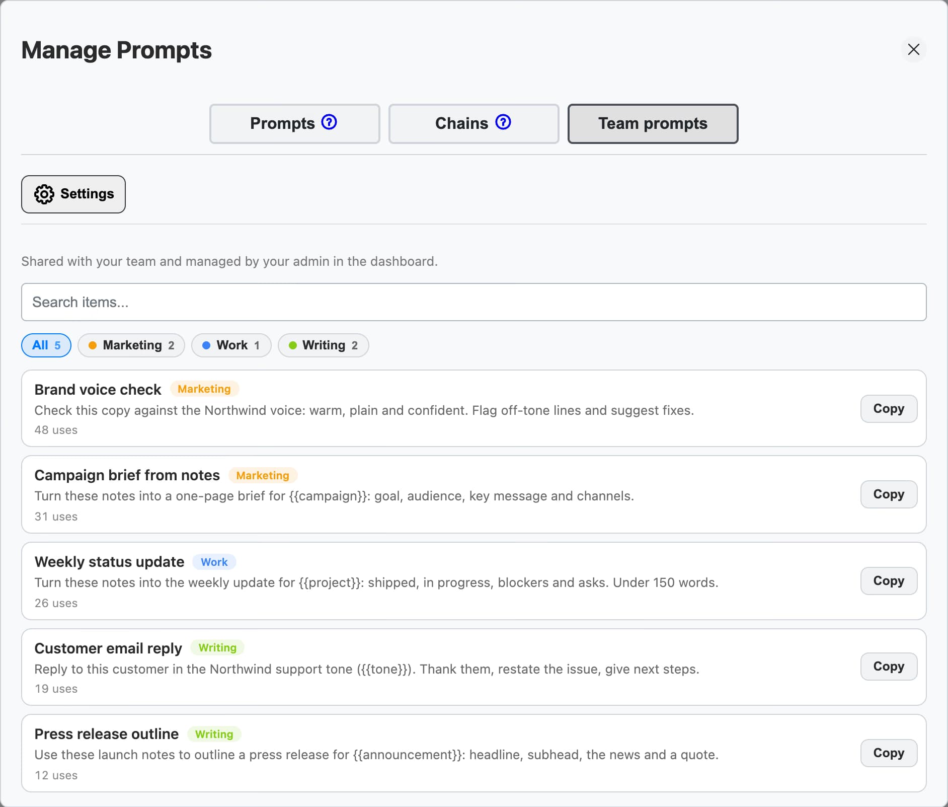 Team prompts tab in Manage Prompts: prompts shared with the team and managed by the admin, with categories, use counts, and Copy buttons
